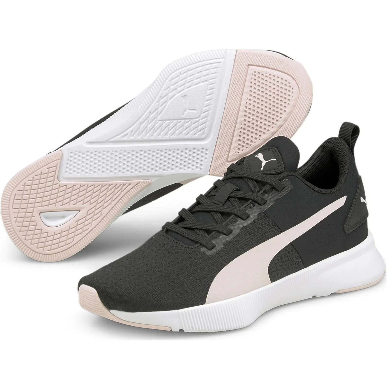 Puma Flyer Runner Femme in Schwarz mit rosafarbenen Details und daneben sichtbarer Laufsohle
