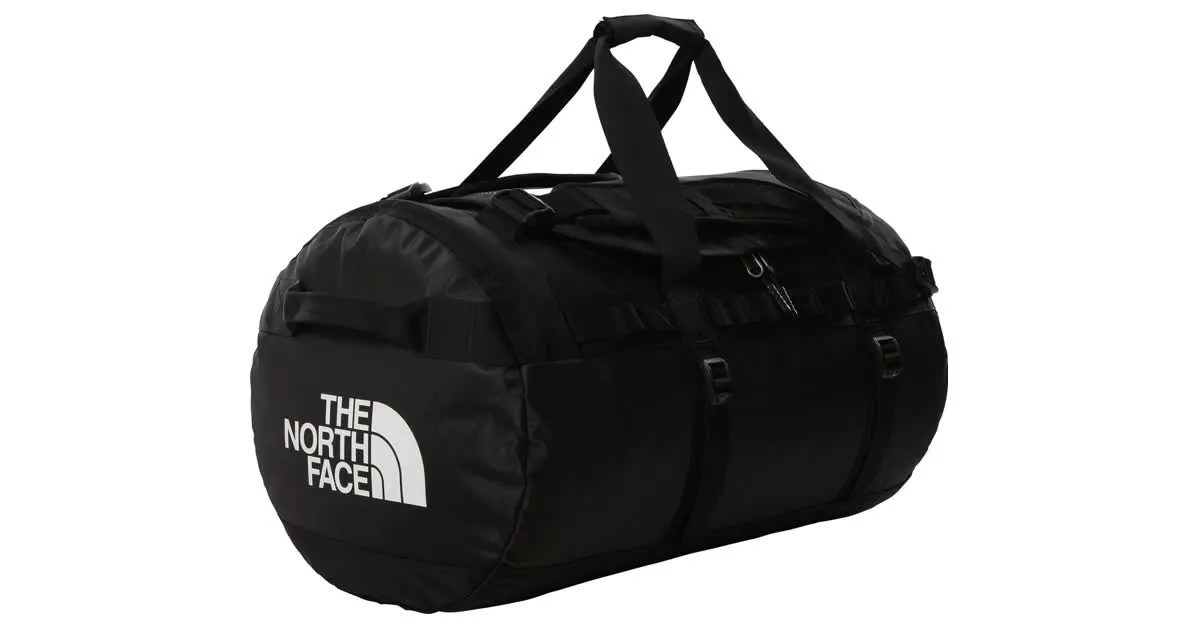 Schwarze Reisetasche The North Face Base Camp Duffel in Größe M mit Tragegriffen, Produktfoto auf weißem Grund